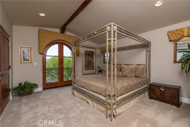 This is bedroom #4, which is the second largest Master Suite.  French doors open to the balcony and the Ocean views!