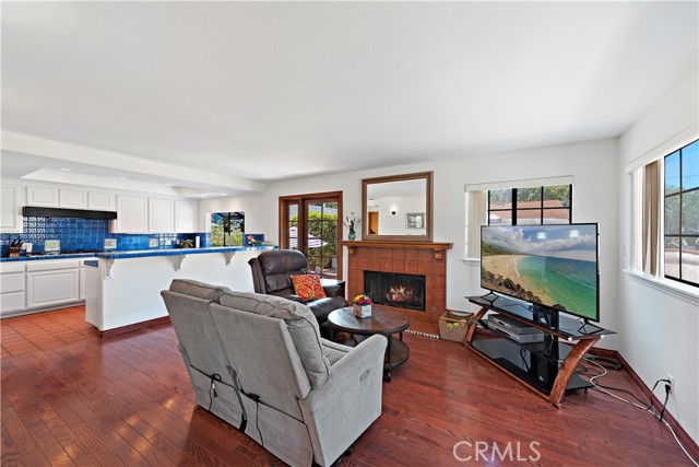 Family room with cozy fireplace and French doors