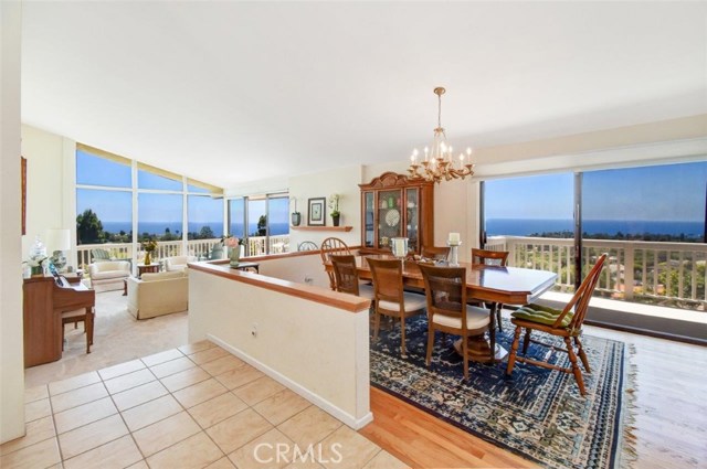 Dining area and step down living room with great ocean views! When it's clear, you can see Catalina on the left side window