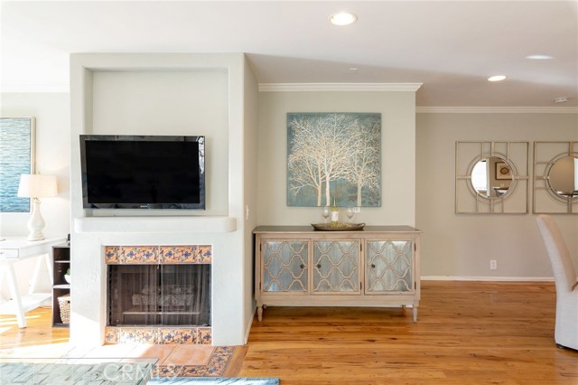 cozy fireplace and hardwood floors