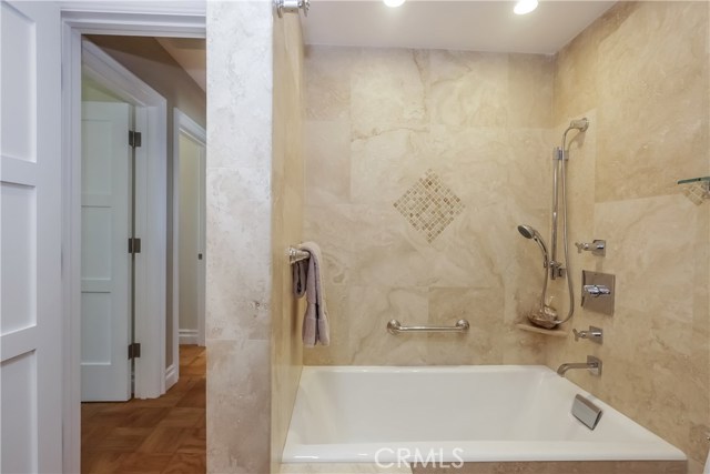 Guest bathroom with large steeping bath tub, and shower.