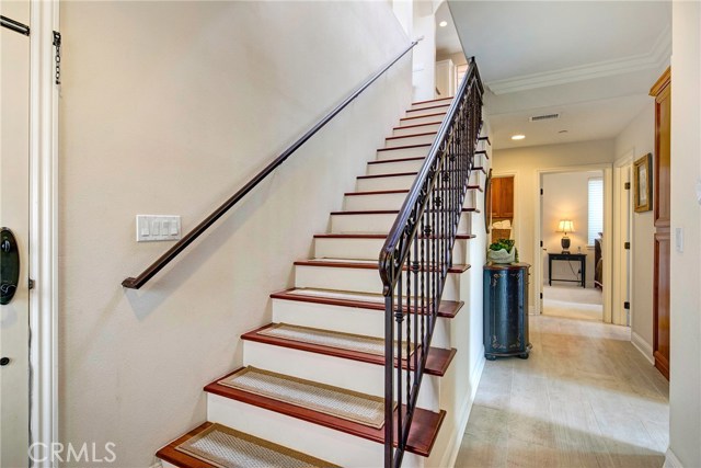 Entry, downstairs with 2 bedrooms, full bath, laundry room, backyard and garage access.  Beautiful wood-like porcelain tile flooring.