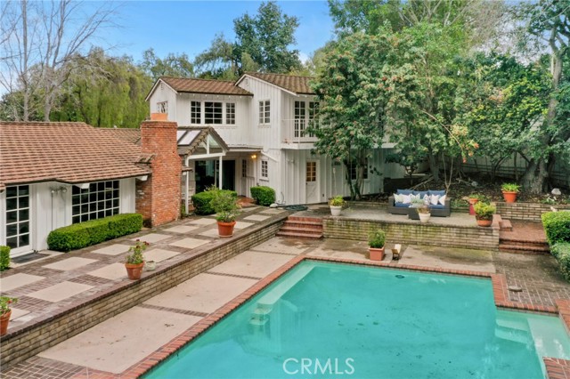 Backside of the home showing the multitude of pool decks and areas for entertaining and family fun!