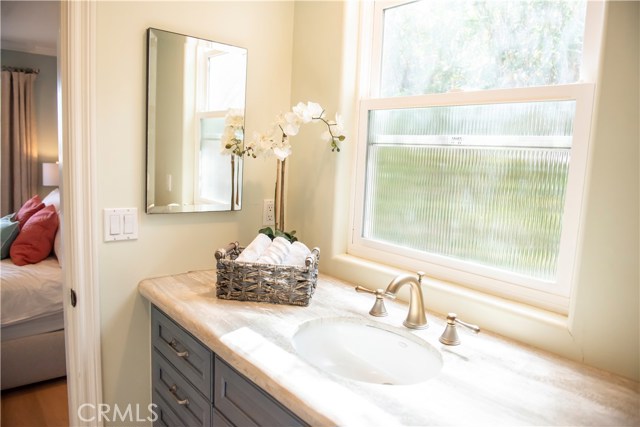 Jack-n-Jill bathroom with granite countertops and heated towel racks.