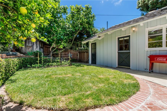 With room for a garden, over a dozen types of fruits and vegetables grows in the backyard. The vegetable garden include: Hot House Tomatoes, Blue Lake Pole Green Beans, Watermelon, Corn, Broccoli, Cantaloupe, Yellow Summer Crookneck Squash, and Sugar Pie Pumpkins.