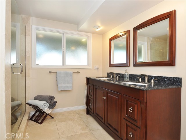 Hallway bath with his and her sinks