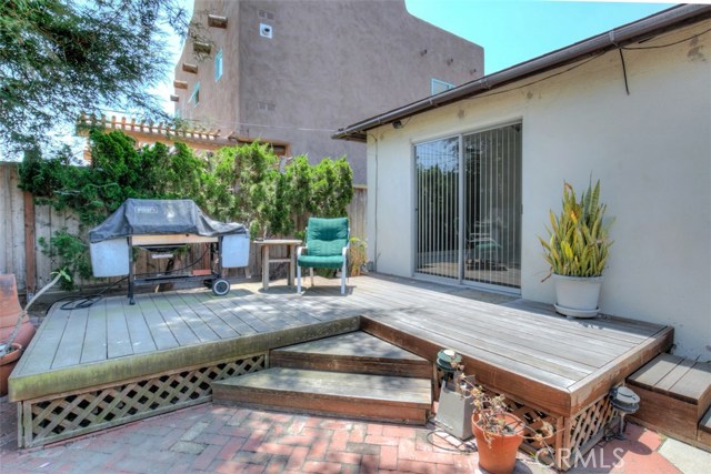 Rear patio deck with shade trees