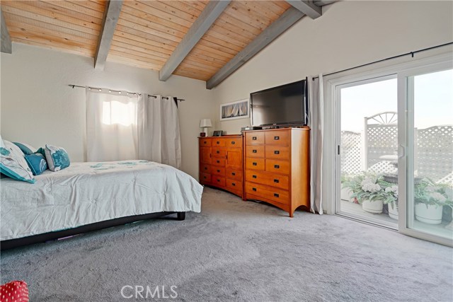 Master bedroom, with private balcony, vaulted ceilings and lots of closet space.