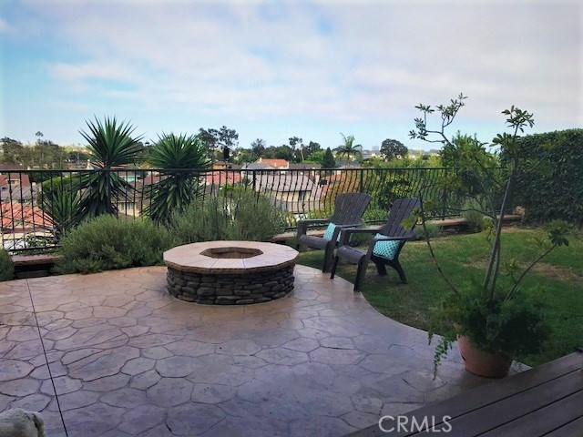 low maintenance backyard with fire pit &  flagstones