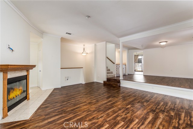 Family room with gas fireplace and A/V hookups above