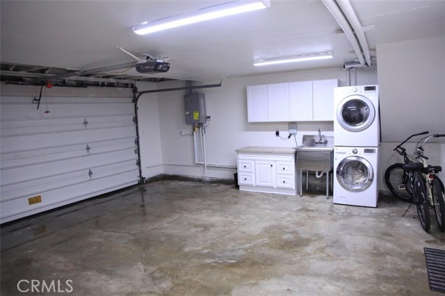 All NEW tankless water heater, copper plumbing, vanity and storage, industrial quality laundry sink, lighting, firedoor to house, drywall and paint. 21'x21' garage.