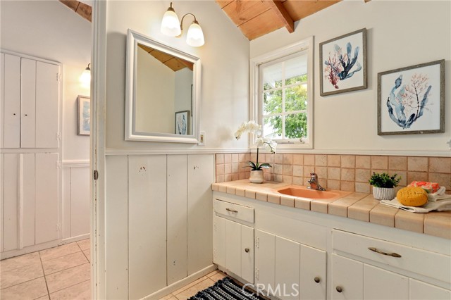 One of two hallway bathrooms that feed the wing of three bedrooms on this side of the home.