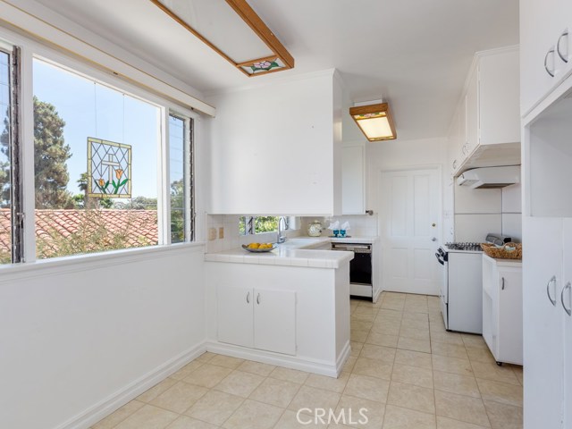 Breakfast nook and kitchen bathed in lots of natural light