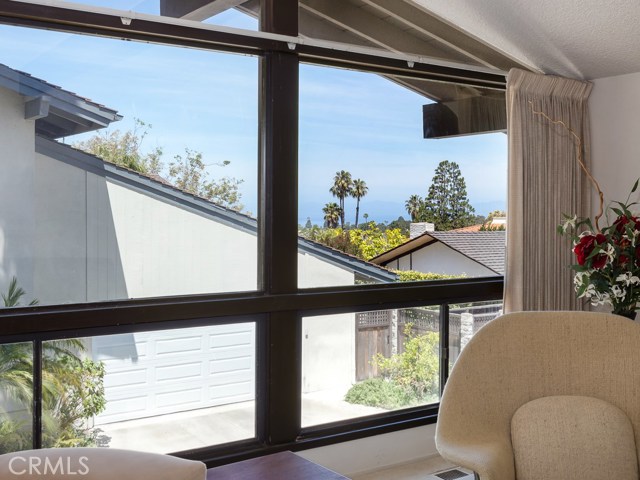 Peek-a-boo Ocean view with the Santa Monica mountains in the distance.