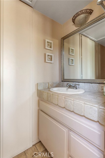 Powder room 1/2 bath on the upper level with living room, dining room and kitchen.