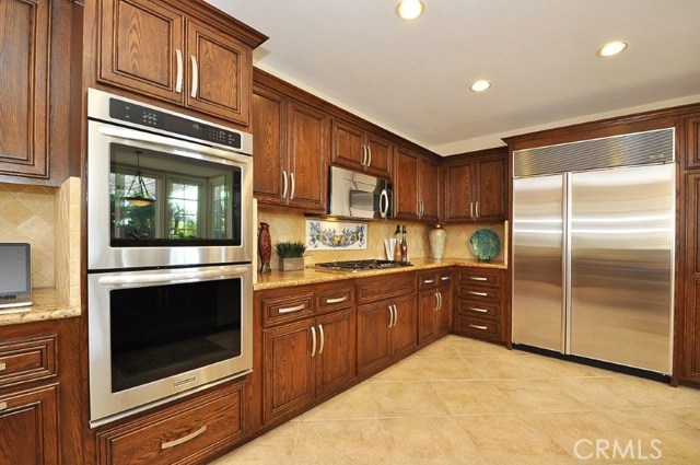 Chef's Kitchen with Stainless Steel Appliances & Subzero Refridgerator