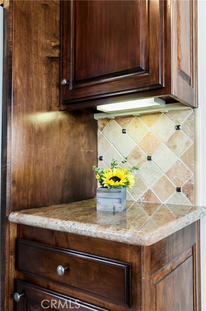 The kitchen also features this beautiful tumbled stone backsplash.
