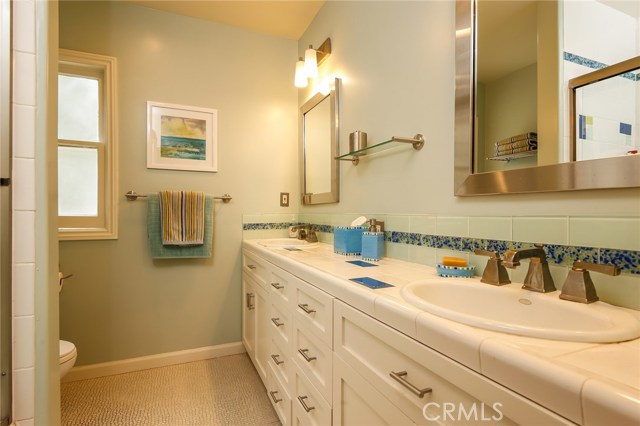 Custom created bathroom with dual sinks, tub and shower