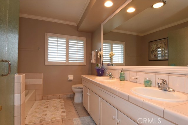 Full updated hall bathroom with separate tub and shower + double sinks.