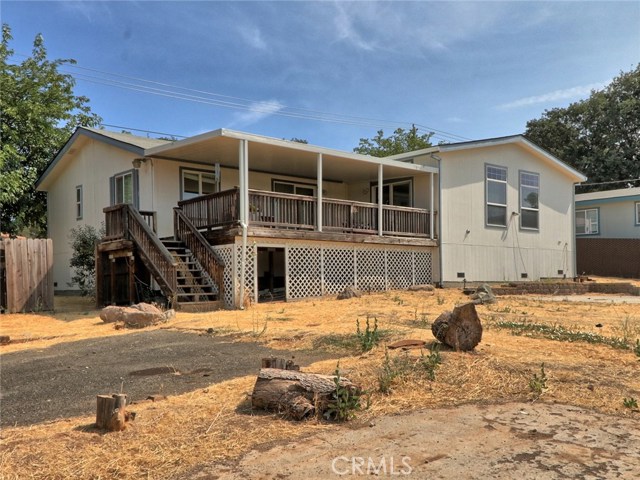 This large back yard has plenty of fenced in space for pets or kids and two patio areas perfect for parking 