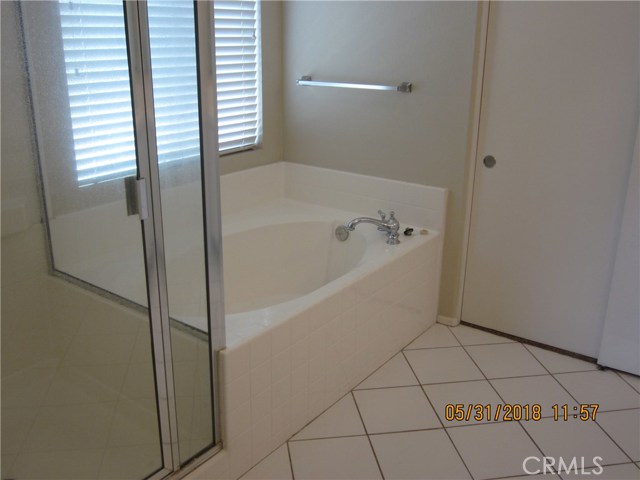 Separate tub and shower in master bathroom.