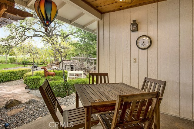 Covered back patio with wood-detailing on the ceilings