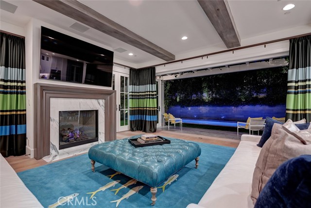 A sense of fun and happiness in the family room leads you out to the pool area