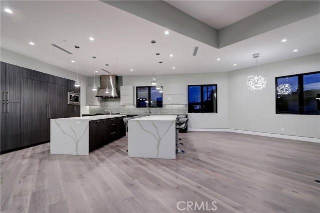 Kitchen with dining style fixture keeps the family all together during meal creation.