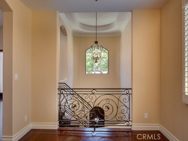 Looking from dining room toward the 2-story stairwell with stunning architectural and decorative details.