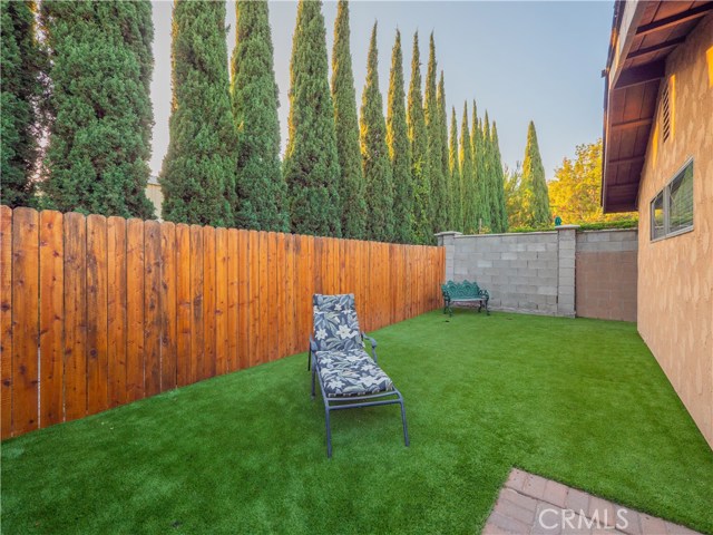 AstroTurf in back and perfect for getting some vitamin D with weekly tanning