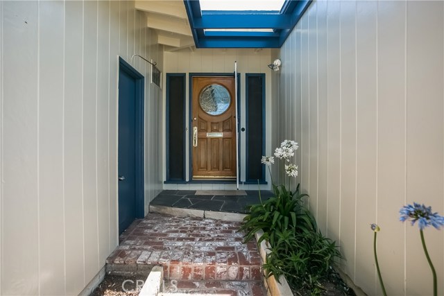 There is a nice   front door with leaded glass and a side door from the garage to the entry for easy access.