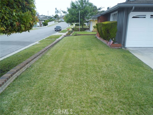 Front Grassy Area...Great for Playing or Just Taking Pride in Ownership.