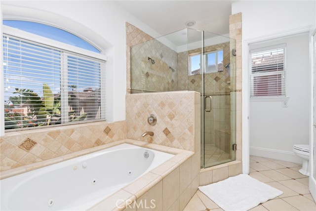 Master bath en-suite with jetted tub and extra large shower with three shower heads.