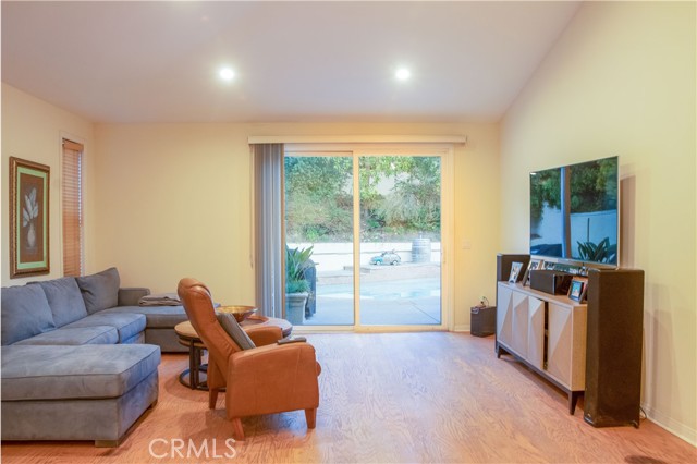 family room area with doors to the outside pool area