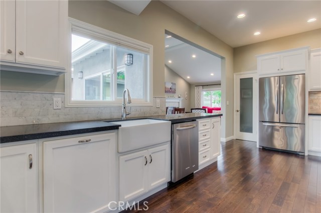 Walk-in Pantry, all stainless appliances, farm house sink. kitchen window looks out on back patio.