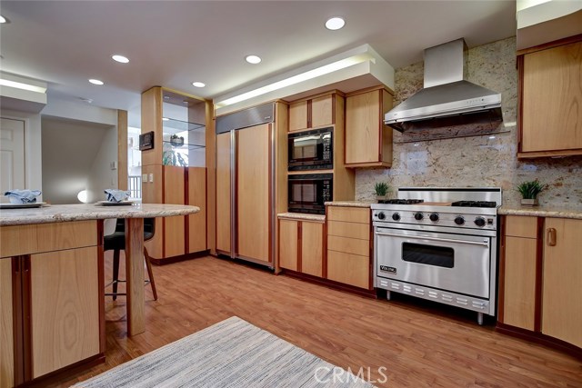 Gourmet Kitchen with high end appliances: Viking gas range, SubZero refrigerator/freezer,Miele dishwasher, two convection microwaves.