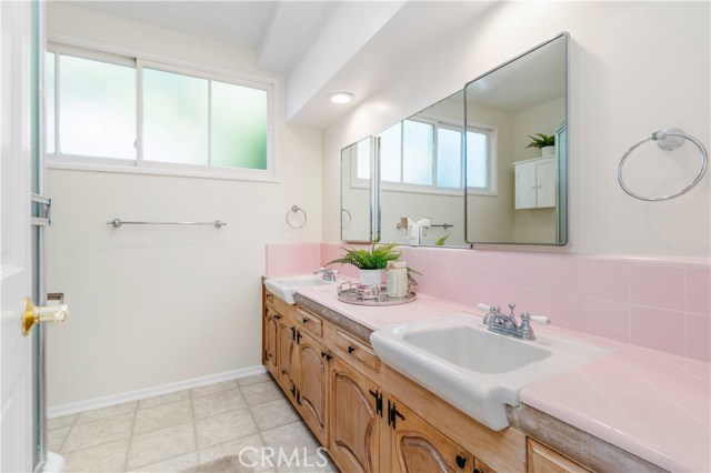 Bathroom #3 - With dual sinks and large bath with shower, the bathroom serves the lower level bedrooms and living spaces.