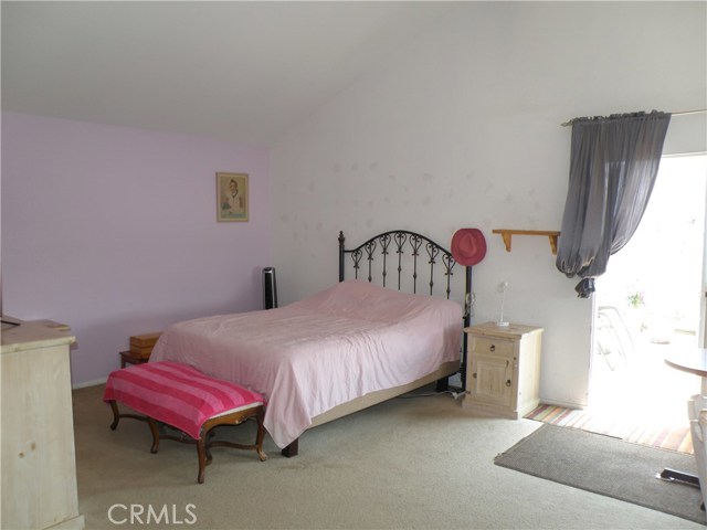 Master bedroom with vaulted ceiling