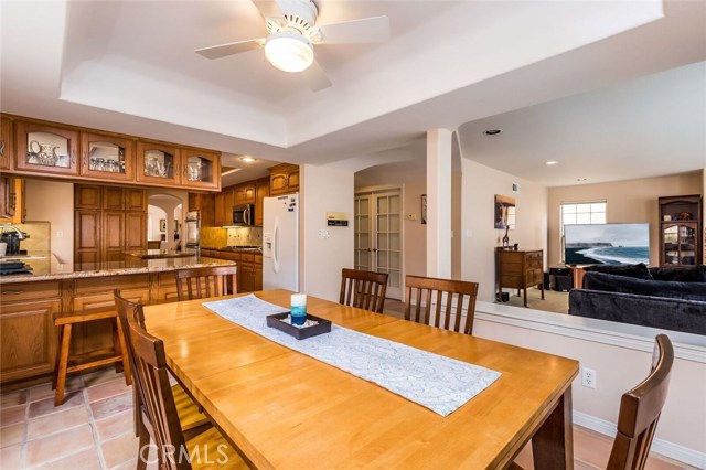 Additional dining area next to the kitchen and open to the family room. There's also a sliding door to the rear yard.