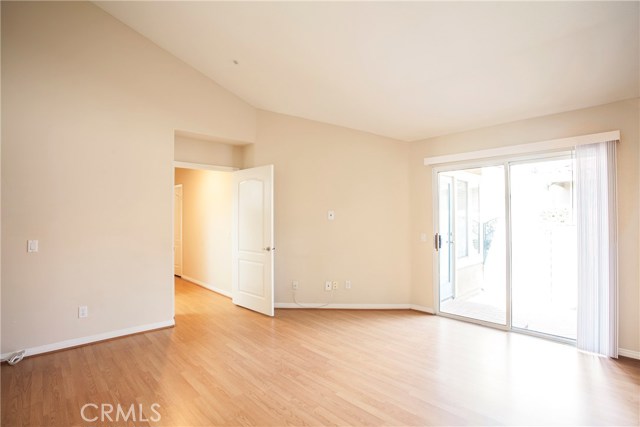 Large master suite with a vaulted ceiling and slider to the patio