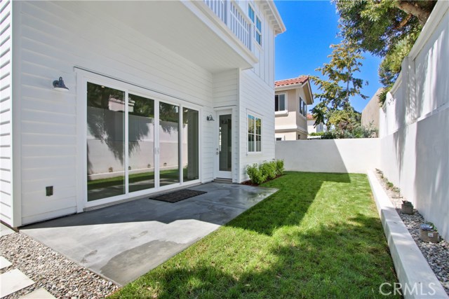 PRIVATE ENCLOSED BACKYARD. NICELY LANDSCAPED GRASS AND OUTSIDE SHOWER.