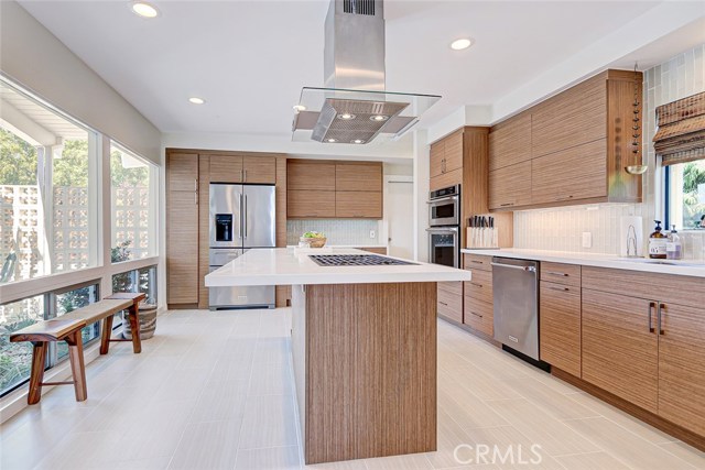 Bright and Airy Contemporary Kitchen with Wolf Cooktop and two dishwashers for easy entertaining.