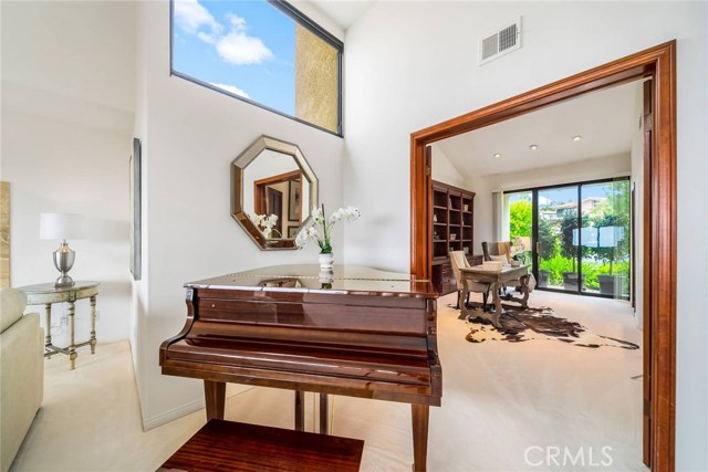 Living room w. high ceilings looking toward office