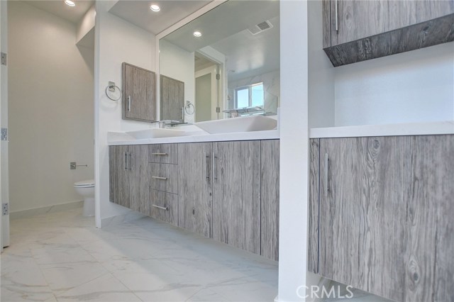 2nd Level . . . Master Bath dual sinks with additional storage and separate water closet