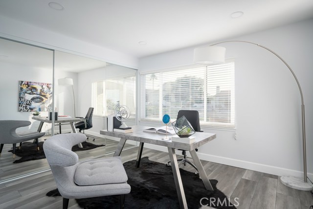 Front bedroom being used as an office. It has a wall to wall closet.