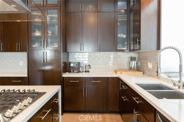 Well designed and functionally thoughtful kitchen, built in wine storage, display cabinets with interior lighting, double stainless sinks... a chef's dream