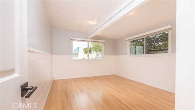Downstairs 3rd bedroom with new floors and windows