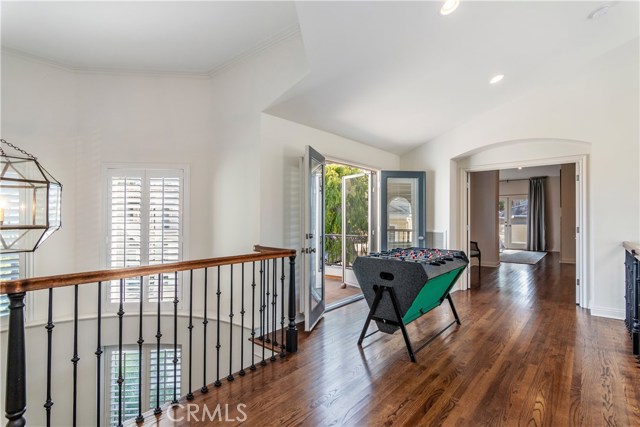 Upstairs gallery looks onto Formal Living room. There is a patio off opening (faces 18th Street)