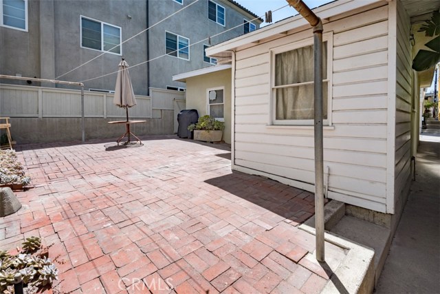 View of patio and storage/future laundry