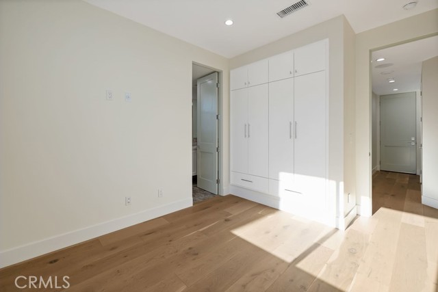 Second bedroom on main floor with shared bath and built in closets